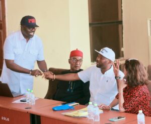 Sitting is the MD of ACTDA exchanging pleasantries with the Mayor of Awka South Council Area, Hon. Chinrdu Okafor (standing).