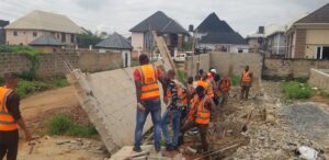 ACTDA Enforcement team demolishing structures and fence walls that have encroached into approved road alignments.