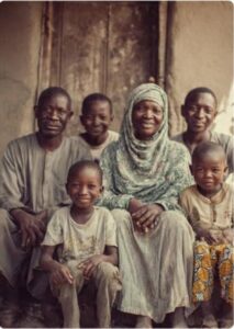 Nigerian couple and children planning with prayer