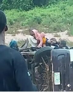 Trapped schoolchildren being rescued from the bus