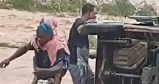Trapped schoolchildren being rescued from the bus