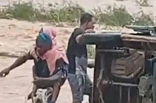 Trapped schoolchildren being rescued from the bus