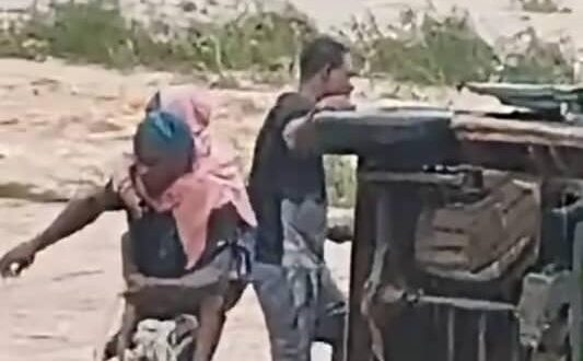 Trapped schoolchildren being rescued from the bus